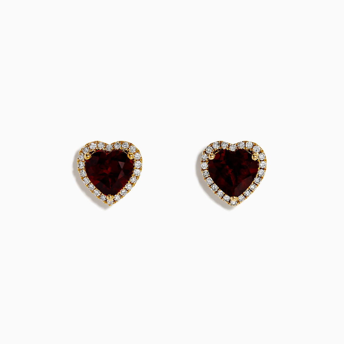 The 14K Yellow Gold Garnet and Diamond Halo Heart Stud Earrings feature deep red heart-shaped garnets at the center, each surrounded by a sparkling diamond halo, all set in yellow gold.
