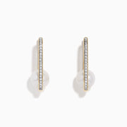 The 14K Yellow Gold Fresh Water Pearl and Diamond Square Hoop Earrings feature a row of sparkling diamonds and a round white freshwater pearl at the base, shown on a plain white background.