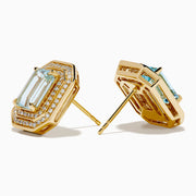 The 14K Yellow Gold Aquamarine and Diamond Double Halo Earrings feature emerald-cut light blue gemstones framed by rectangular diamond double halos.