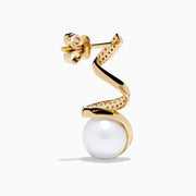 The 14K Yellow Gold Fresh Water Pearl and Diamond Ribbon Earrings feature a spiral gold design encrusted with small diamonds, elegantly encircling a large freshwater pearl, all showcased on a plain white background.
