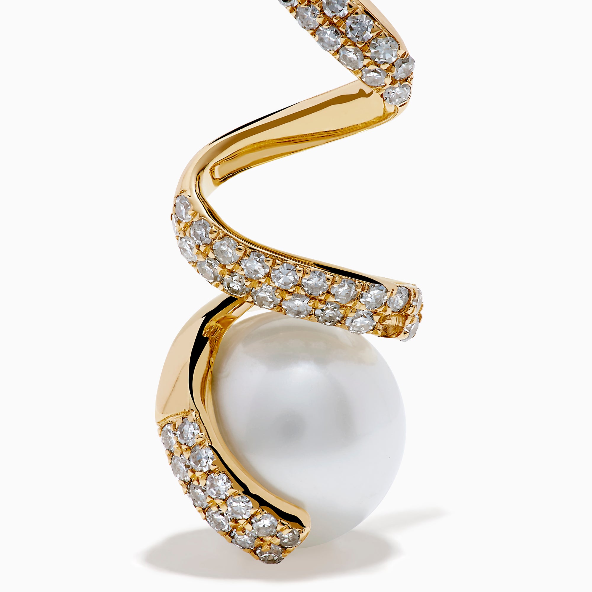 The 14K Yellow Gold Fresh Water Pearl and Diamond Ribbon Earrings feature a spiral gold design encrusted with small diamonds, elegantly encircling a large freshwater pearl, all showcased on a plain white background.