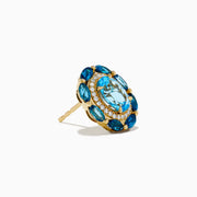 The Ocean Bleu 14K Yellow Gold Blue Topaz and Diamond Earrings showcase an oval blue topaz center, accented by smaller blue stones and sparkling diamonds, set in yellow gold and presented against a white background.