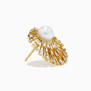 The 14K Yellow Gold Diamond and Pearl Sunburst Stud Earrings feature a large central pearl accented by radiating spokes adorned with clear, rectangular, and round gemstones in a striking sunburst design.