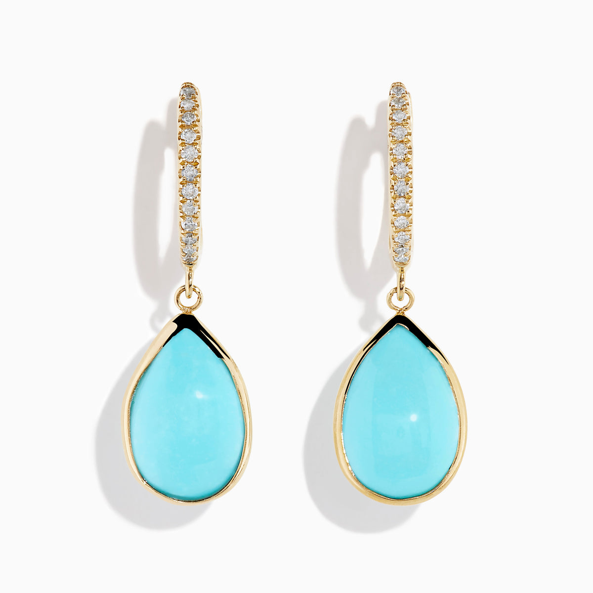 The 14K Yellow Gold Turquoise and Diamond Drop Earrings feature teardrop turquoise stones and sparkling diamonds along the hooks, shown on a white background.