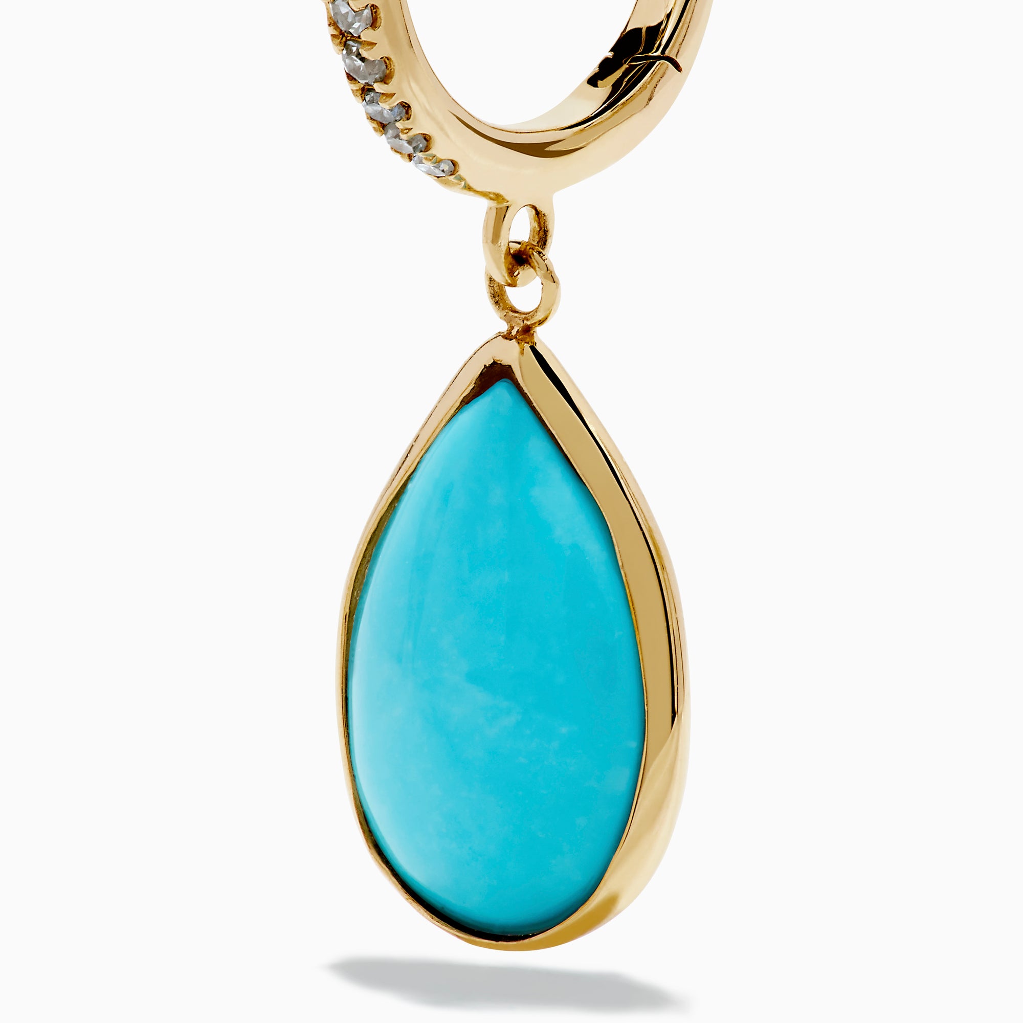 The 14K Yellow Gold Turquoise and Diamond Drop Earrings feature teardrop turquoise stones and sparkling diamonds along the hooks, shown on a white background.