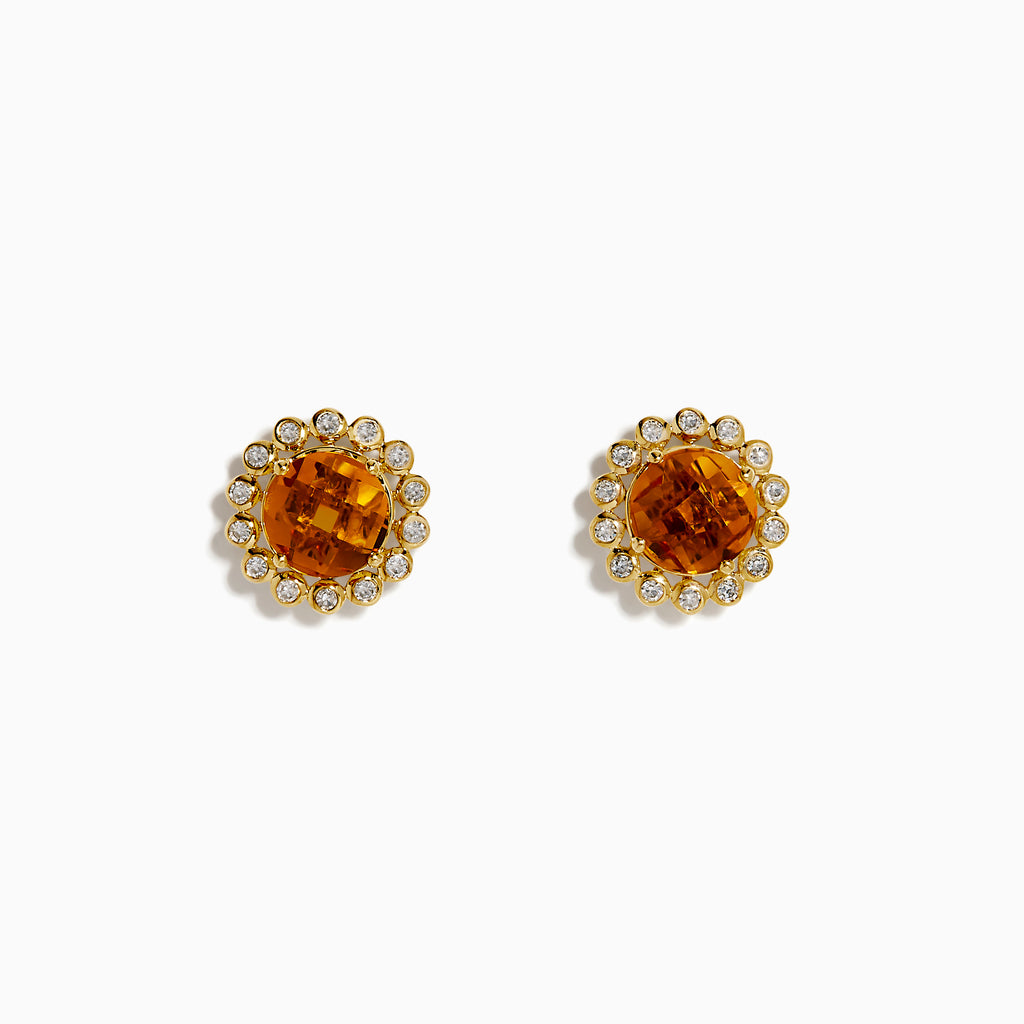 The 14K Yellow Gold Citrine and Diamond Halo Stud Earrings feature round orange citrine centers encircled by a halo of sparkling diamonds, all set in yellow gold.