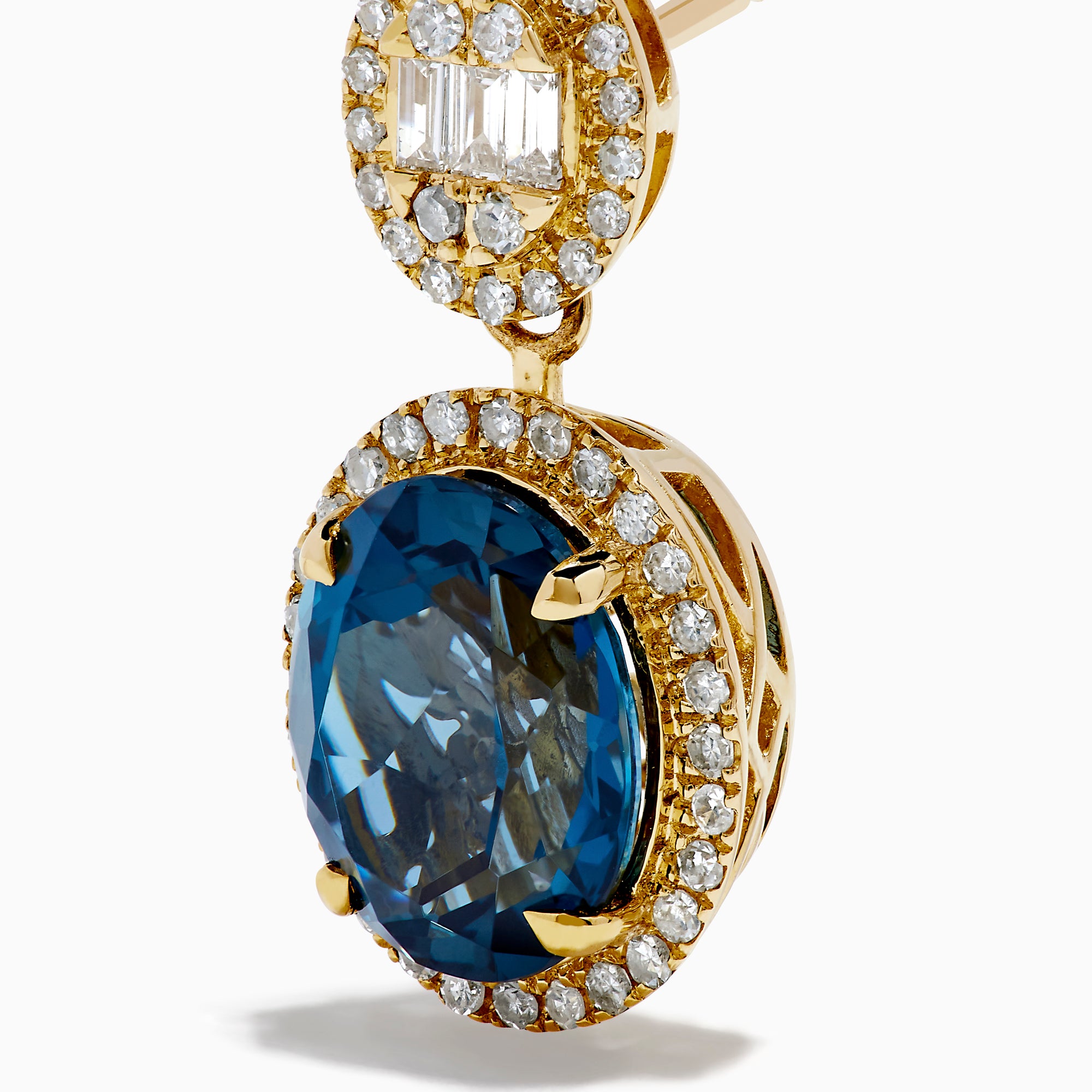 The 14K Yellow Gold Blue Topaz and Diamond Oval Drop Earrings feature large oval blue topaz gemstones encircled by white diamonds, with a sparkling diamond cluster above each stone for an elegant drop design.