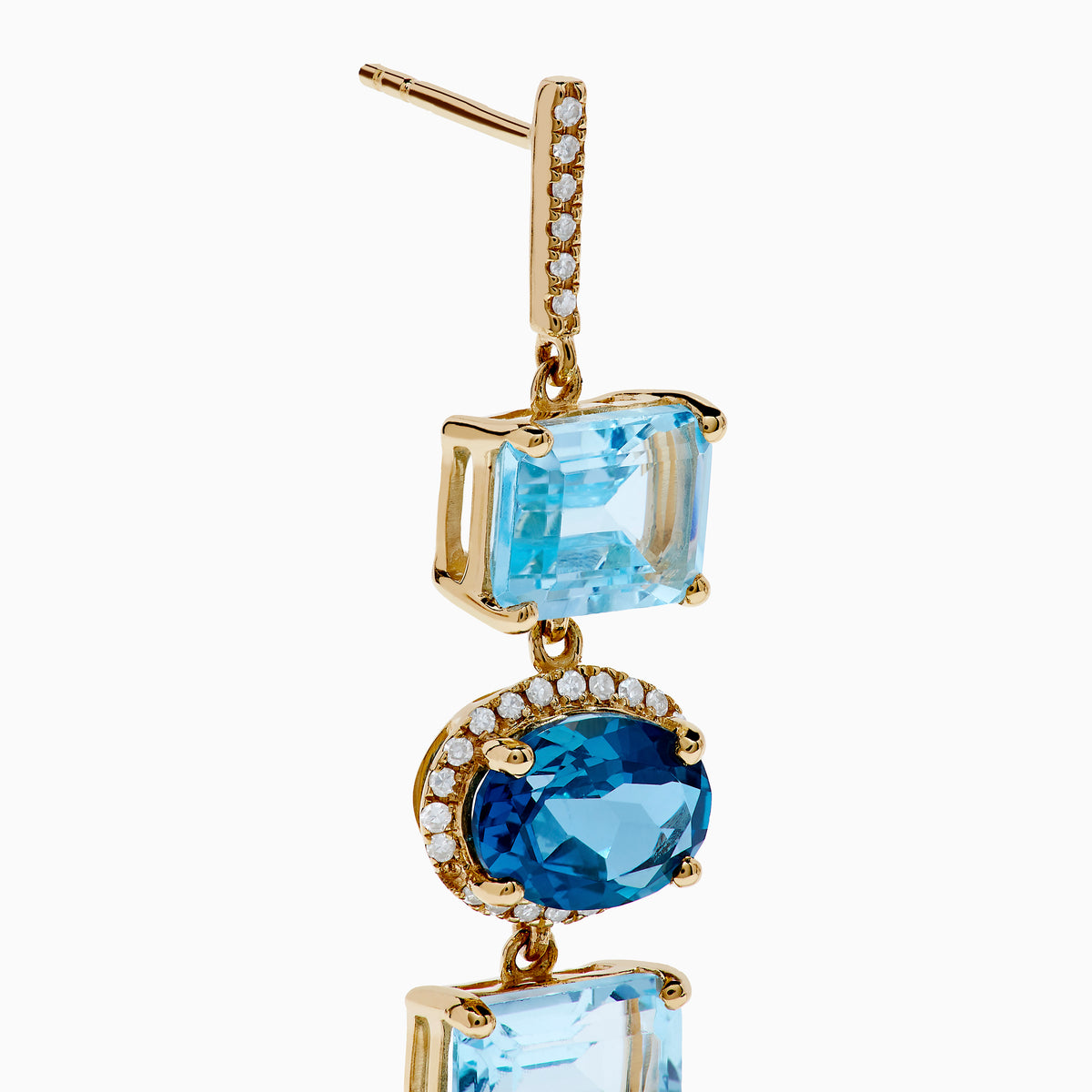The 14K Yellow Gold Blue Topaz and Diamond Drop Earrings feature square and teardrop blue topaz gems, accented by sparkling diamonds for a layered, elegant look.