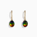 The 14K Yellow Gold Ammolite and Diamond Drop Earrings feature oval ammolite gemstones and sparkling diamonds on the hooks, shown against a white background.