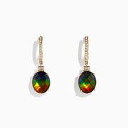 The 14K Yellow Gold Ammolite and Diamond Drop Earrings feature oval ammolite gemstones and sparkling diamonds on the hooks, shown against a white background.