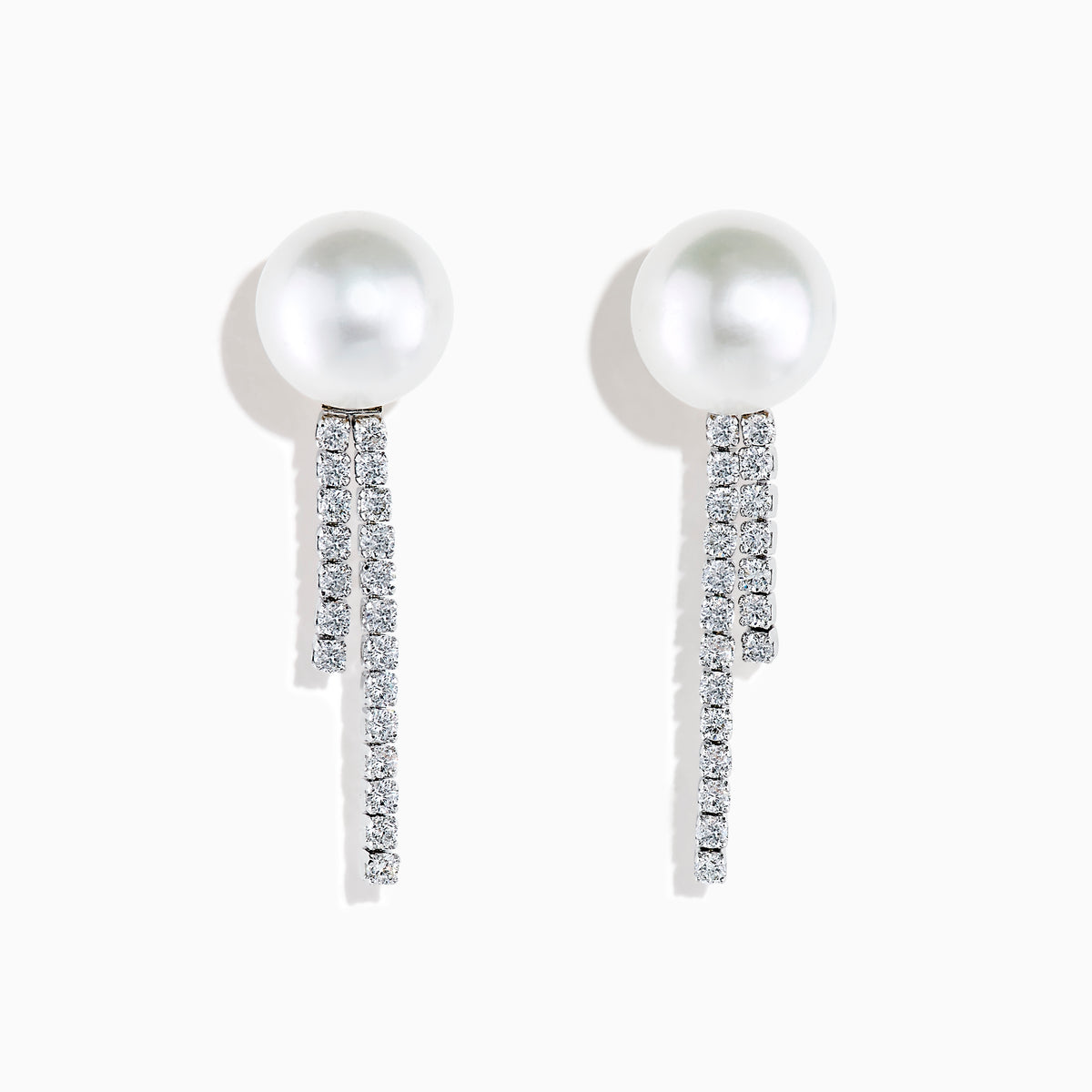 The 14K White Gold Cultured Pearl and Diamond Drop Earrings feature round cultured pearls atop two vertical rows of sparkling diamonds, all set against a plain white background.