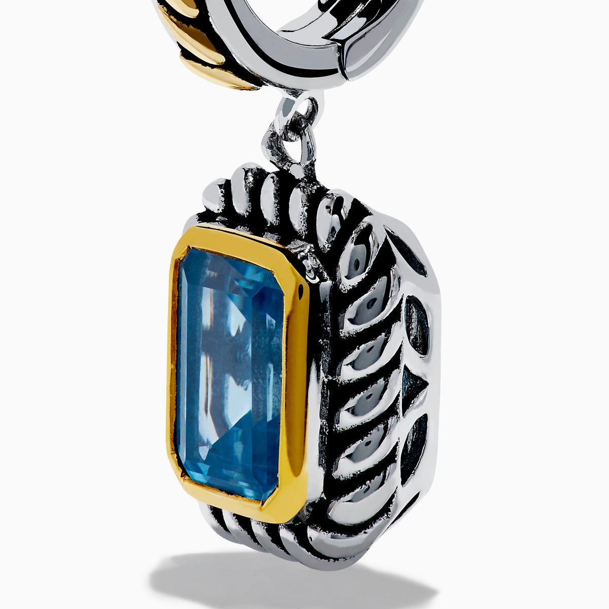 The Ocean Bleu 925 Sterling Silver and 18K Yellow Gold Blue Topaz Earrings feature rectangular gemstones in a twisted rope design with gold-accented posts, shown against a white background.