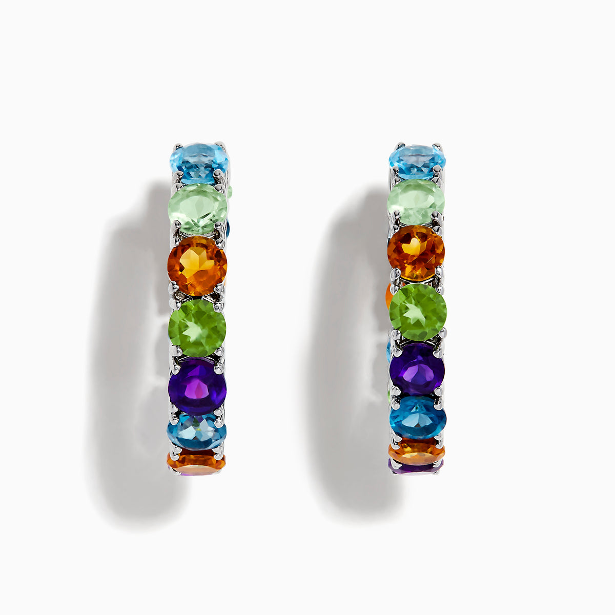 The 925 Mosaic Sterling Silver Multi Gemstone Hoop Earrings feature vibrant blue, green, orange, purple, and yellow gemstones arranged in a repeating pattern along the front of each hoop.
