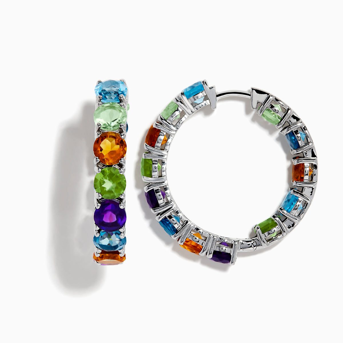 The 925 Mosaic Sterling Silver Multi Gemstone Hoop Earrings feature vibrant blue, green, orange, purple, and yellow gemstones arranged in a repeating pattern along the front of each hoop.