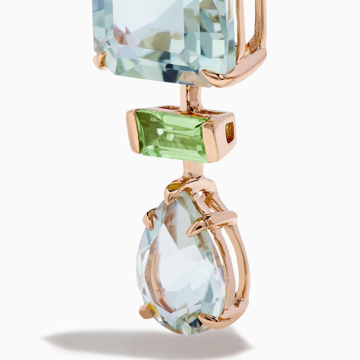 These 14K rose gold earrings feature square, rectangular, and teardrop-shaped green amethyst and peridot gemstones in light blue and green.