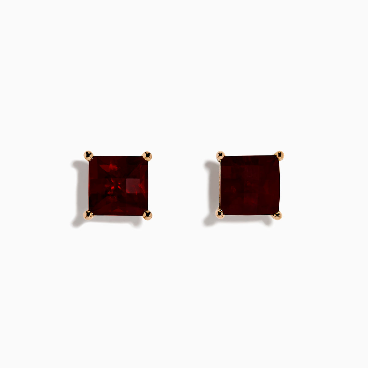A pair of 14K Rose Gold Garnet Stud Earrings, featuring square-cut deep red garnets in gold prongs, displayed on a plain white background.