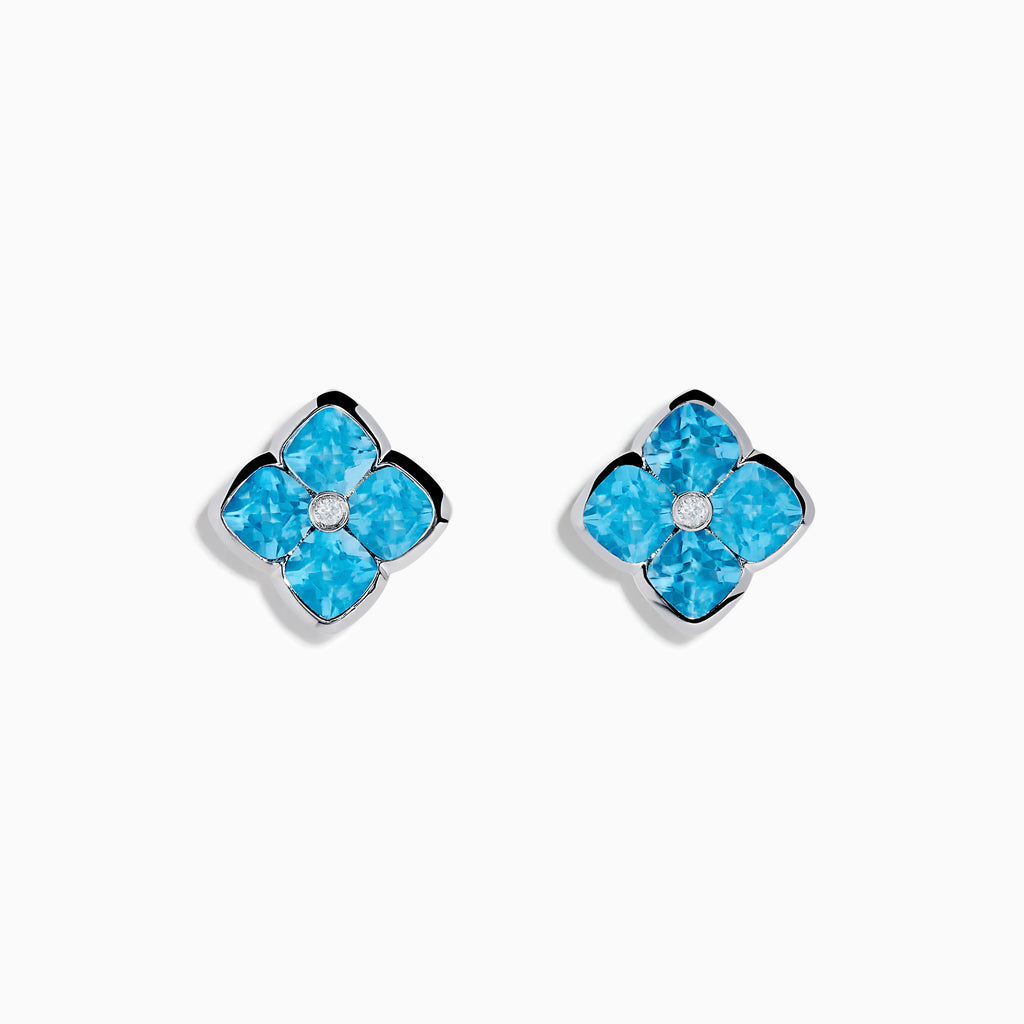 The Ocean Bleu 14K White Gold Blue Topaz and Diamond Earrings feature flower-shaped studs with four blue topaz petals and a central round diamond, all set in elegant white gold.
