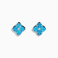The Ocean Bleu 14K White Gold Blue Topaz and Diamond Earrings feature flower-shaped studs with four blue topaz petals and a central round diamond, all set in elegant white gold.