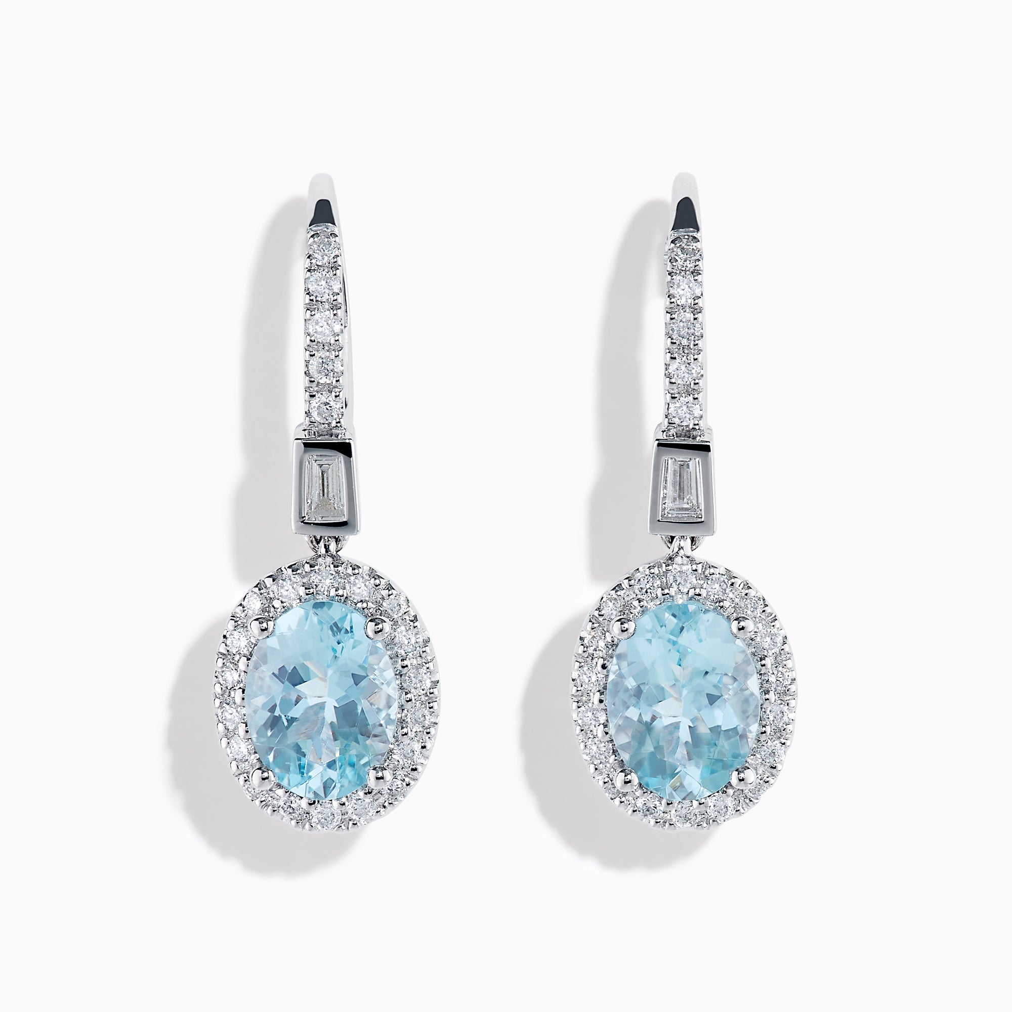 14K White Gold Aquamarine and Diamond Dangle Earrings feature oval aquamarines encircled by sparkling diamonds, with additional diamonds on the hooks—an elegant choice for any occasion.