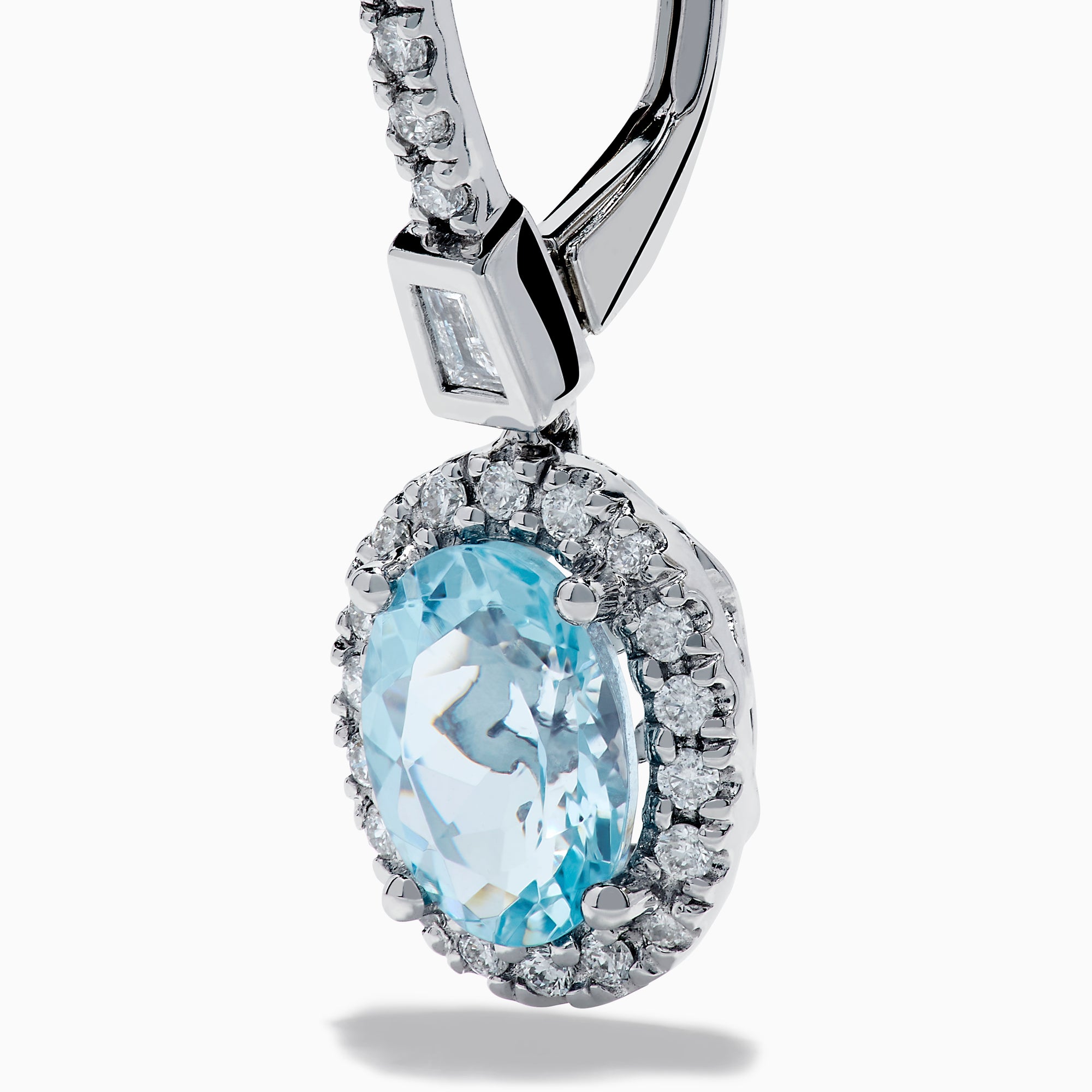 14K White Gold Aquamarine and Diamond Dangle Earrings feature oval aquamarines encircled by sparkling diamonds, with additional diamonds on the hooks—an elegant choice for any occasion.