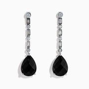 A pair of 14K White Gold Black Onyx and Diamond Linear Drop Earrings featuring alternating diamonds and black onyx gemstones, ending with a large faceted teardrop-shaped black onyx for a timeless look.