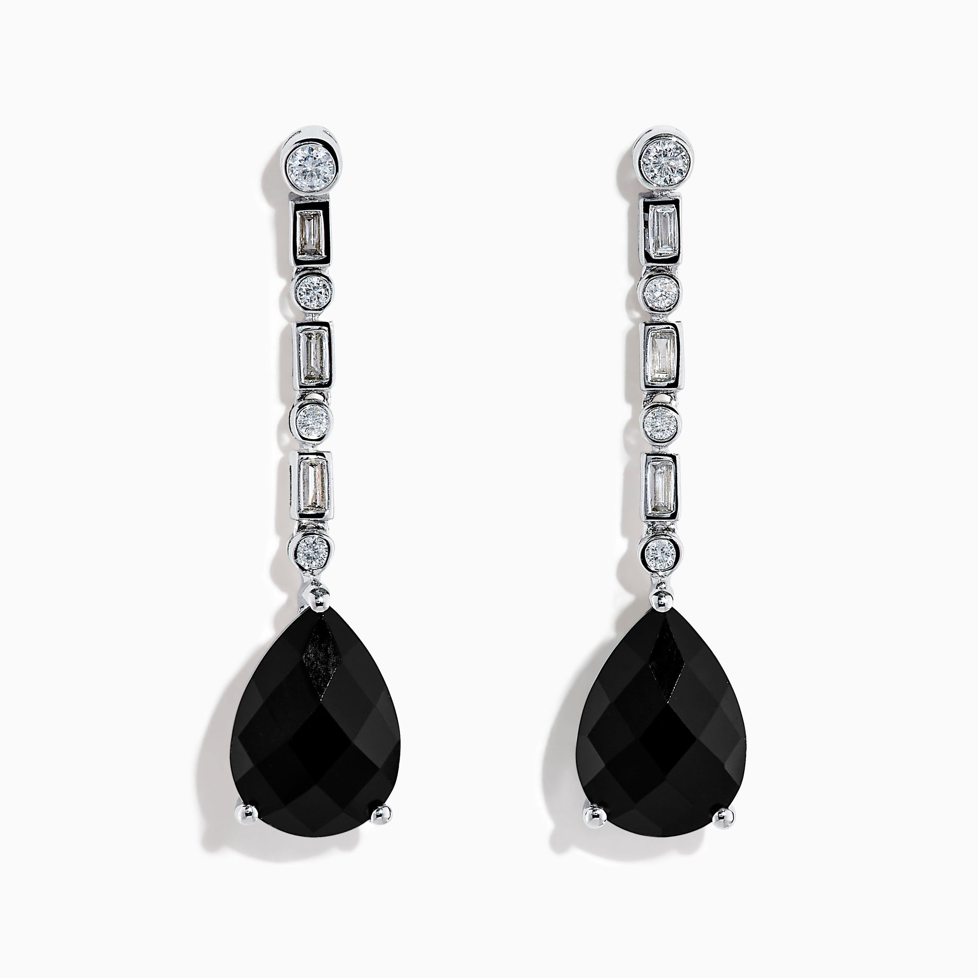 A pair of 14K White Gold Black Onyx and Diamond Linear Drop Earrings featuring alternating diamonds and black onyx gemstones, ending with a large faceted teardrop-shaped black onyx for a timeless look.