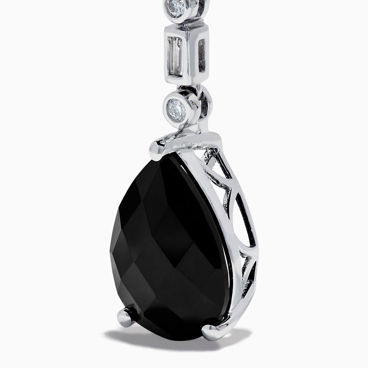 A pair of 14K White Gold Black Onyx and Diamond Linear Drop Earrings featuring alternating diamonds and black onyx gemstones, ending with a large faceted teardrop-shaped black onyx for a timeless look.