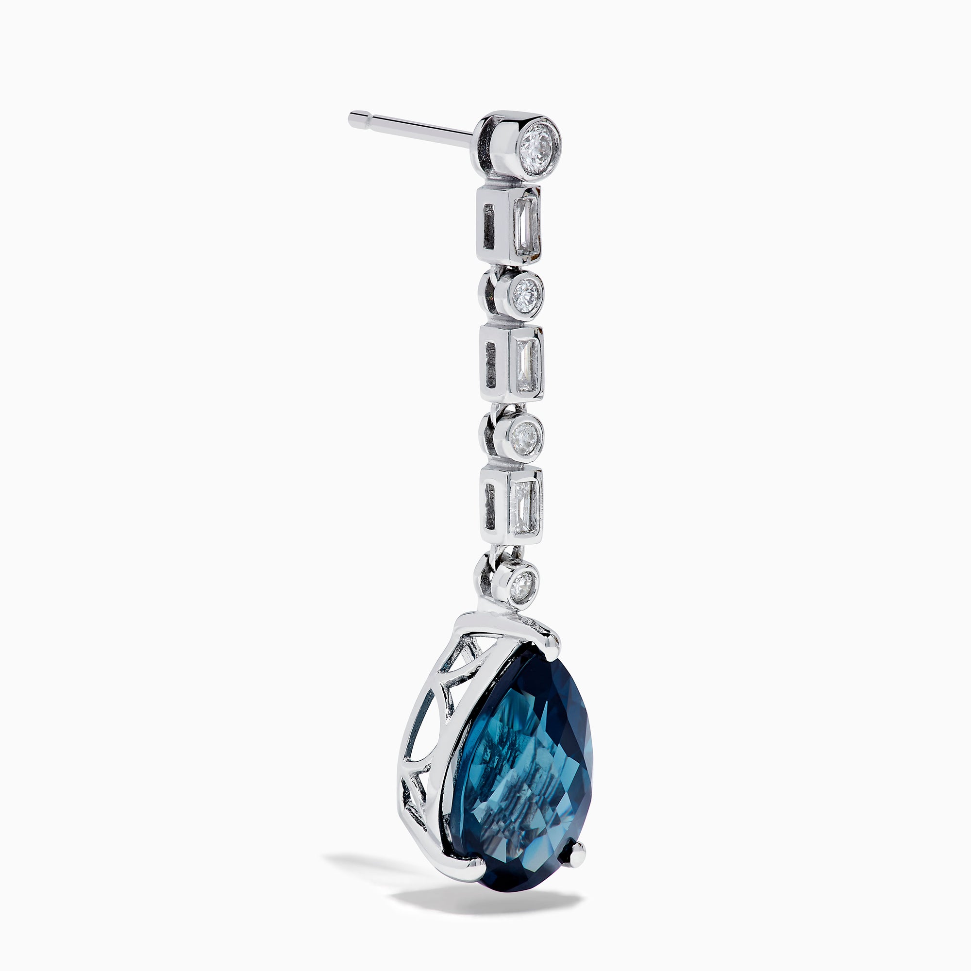 The 14K White Gold Blue Topaz and Diamond Linear Drop Earrings feature large teardrop-shaped blue topaz gems with a vertical row of round and rectangular diamonds set above each stone.