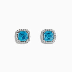 14K White Gold Blue Zircon and Diamond Stud Earrings featuring square-cut blue zircon stones, each encircled by a halo of sparkling diamonds, set on a white background.