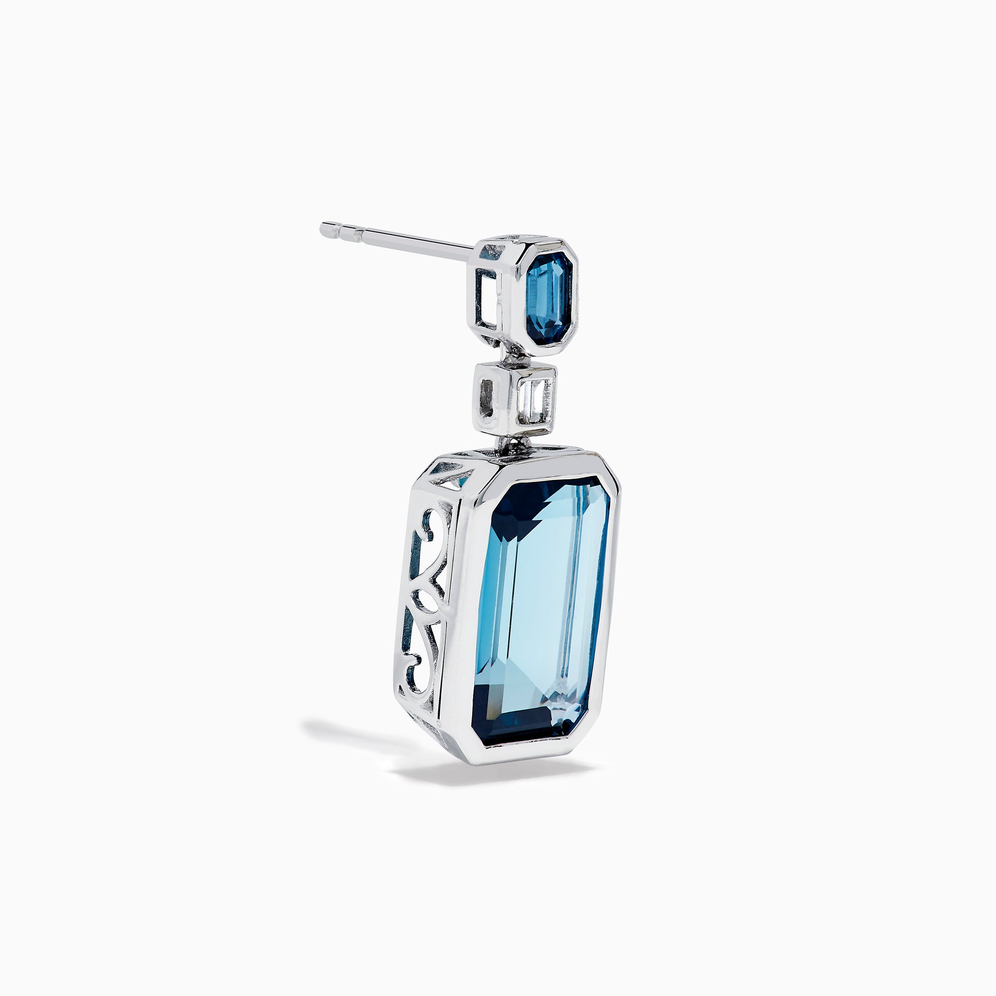 14K White Gold Blue Topaz and Diamond Geometric Drop Earrings featuring rectangular deep blue topaz gems, each accented by a smaller blue stone and a baguette-cut diamond, displayed against a white background.
