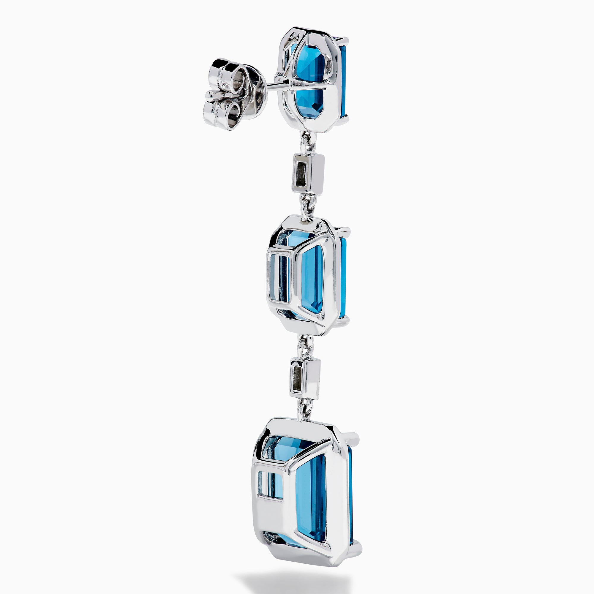 14K White Gold Blue Topaz and Diamond Linear Drop Earrings featuring three rectangular blue topaz gems and two small vertical diamonds in an alternating, linear pattern.