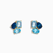 The Ocean Bleu 14K Yellow Gold Sky, London, and Blue Topaz Earrings feature three blue topaz stones—oval, rectangular, and teardrop—set closely together in yellow gold, showcasing varied blue shades similar to classic topaz earrings.