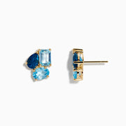The Ocean Bleu 14K Yellow Gold Sky, London, and Blue Topaz Earrings feature three blue topaz stones—oval, rectangular, and teardrop—set closely together in yellow gold, showcasing varied blue shades similar to classic topaz earrings.