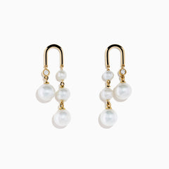 The 14K Yellow Gold Fresh Water Pearl and Diamond Drop Earrings feature a stud with a single diamond and three dangling freshwater pearls, displayed against a white background.