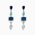 The 14K Yellow Gold Diamond Blue Topaz, Iolite and Apatite Earrings feature blue gemstones in teardrop, rectangular, and marquise shapes, arranged vertically for a colorful and elegant design.