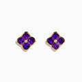 14K Yellow Gold Amethyst and Diamond Earrings featuring four-petaled flower shapes with vivid amethyst petals and a central round diamond, shown on a white background—ideal as elegant statement earrings.