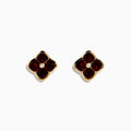 14K Yellow Gold Garnet and Diamond Earrings featuring four-petaled flower studs with deep red garnet petals and a small diamond center, shown on a white background.