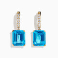 The 14K Yellow Gold Blue Topaz and Diamond Dangle Earrings feature large emerald-cut blue topaz gemstones and small round diamonds, displayed elegantly on a white background.