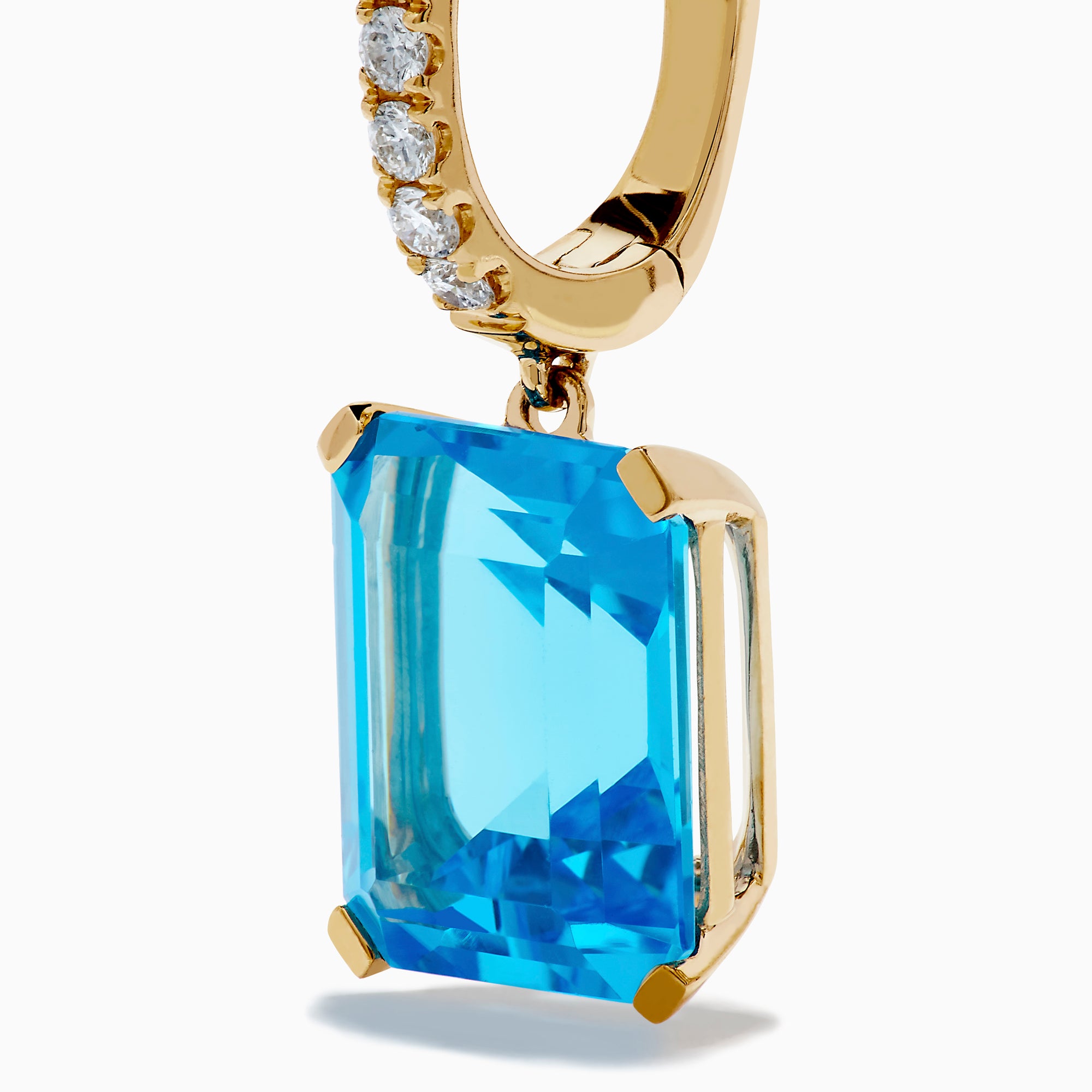 The 14K Yellow Gold Blue Topaz and Diamond Dangle Earrings feature large emerald-cut blue topaz gemstones and small round diamonds, displayed elegantly on a white background.