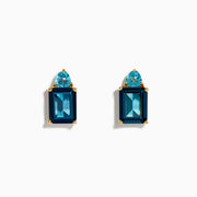 A pair of 14K Yellow Gold Sky Blue and London Blue Topaz Stud Earrings, featuring rectangular dark blue stones and teardrop-shaped light blue accents, shown on a white background.