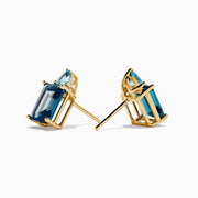 A pair of 14K Yellow Gold Sky Blue and London Blue Topaz Stud Earrings, featuring rectangular dark blue stones and teardrop-shaped light blue accents, shown on a white background.