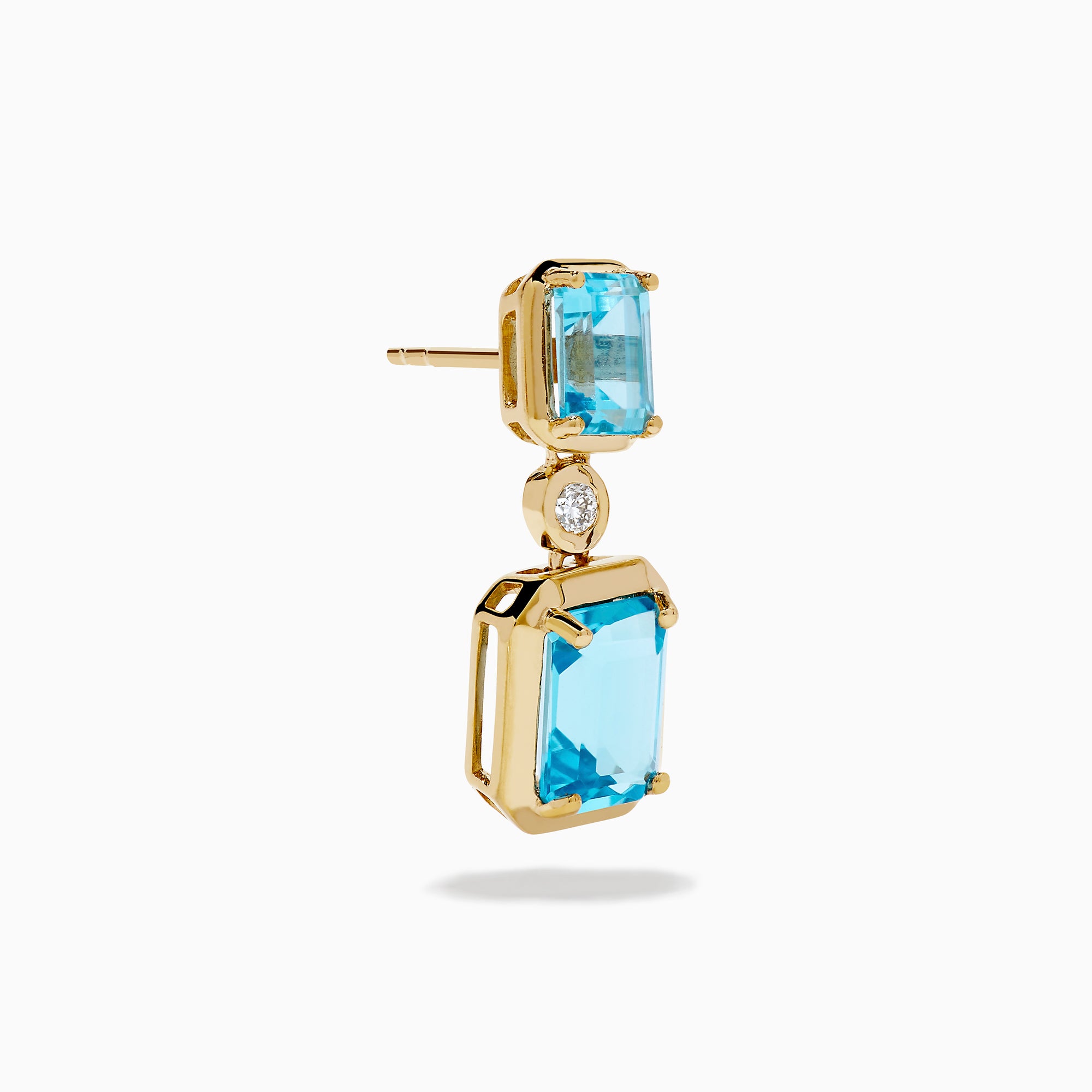 Elegant and symmetrical, the 14K Yellow Gold Blue Topaz and Diamond Drop Earrings display rectangular blue topaz stones with smaller gems above, separated by a sparkling diamond drop, set against a white background.