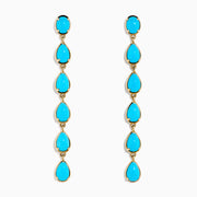 The 14K Yellow Gold Turquoise Pear Shaped Linear Drop Earrings feature four teardrop-shaped turquoise stones and a single oval stone at the top of each earring, shown against a white background.
