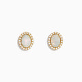 The Aurora 14K Yellow Gold Opal and Diamond Stud Earrings feature oval opals encircled by a halo of sparkling diamonds, set in yellow gold and shown against a white background.