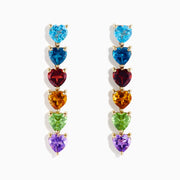 The 14K Yellow Gold Multi-Gemstone Heart Linear Drop Earrings feature five heart-shaped gems in blue, red, orange, green, and purple arranged vertically in a rainbow gradient.