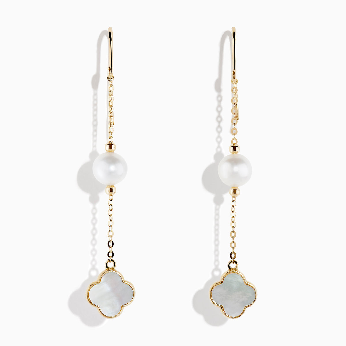 14K Yellow Gold Earrings showcase a round cultured pearl and a four-leaf clover-shaped white mother-of-pearl charm, set against a white background.