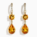 The 14K Yellow Gold Citrine and Diamond Dangle Earrings feature round and teardrop citrine gemstones with diamond accents on the clasps and between the stones, shown against a white background.