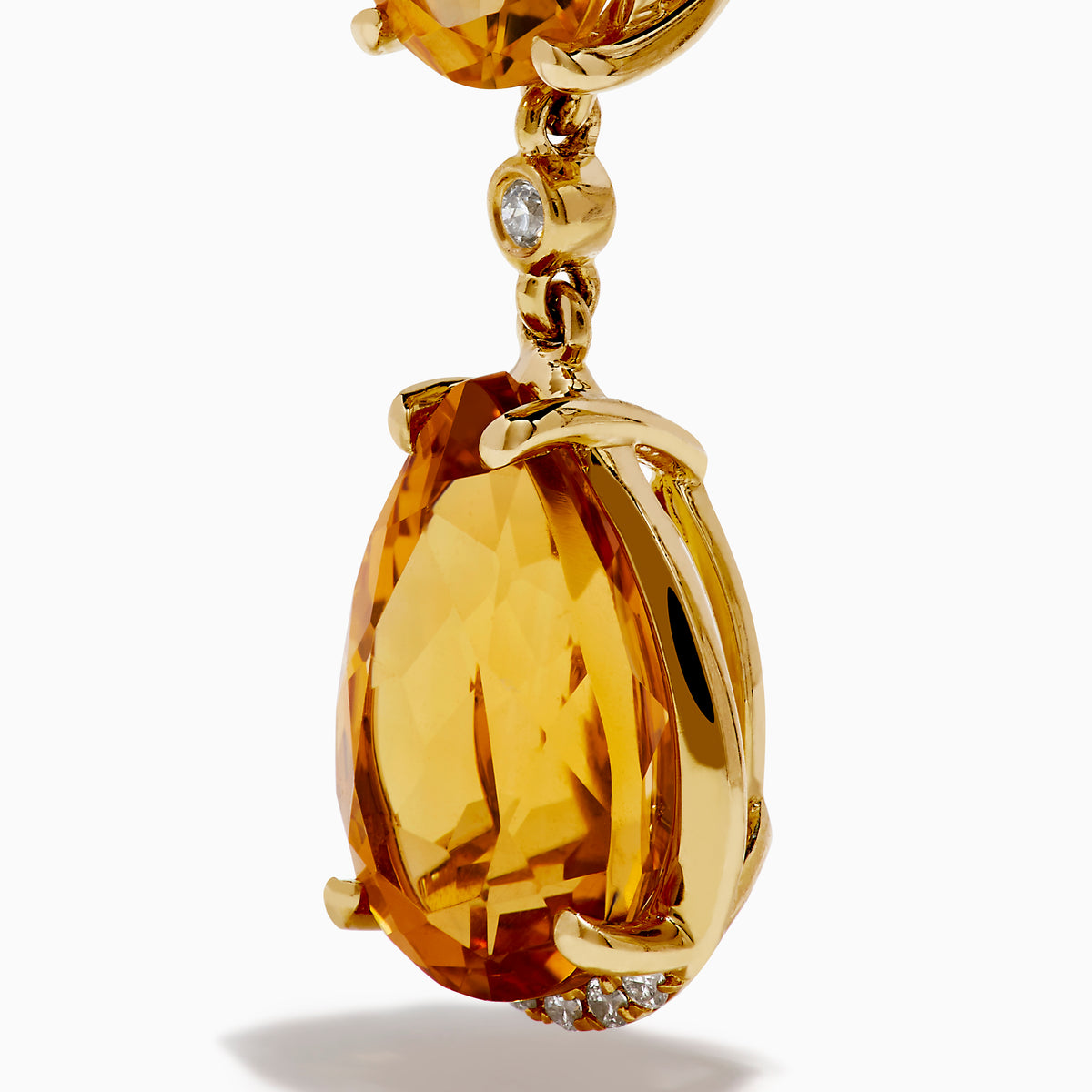 The 14K Yellow Gold Citrine and Diamond Dangle Earrings feature round and teardrop citrine gemstones with diamond accents on the clasps and between the stones, shown against a white background.