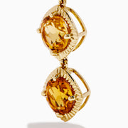 14K Yellow Gold Citrine Linear Drop Earrings feature three square, faceted citrine gemstones in each earring, set in textured gold frames and displayed on a white background.