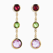 The 14K Yellow Gold Diamond and Multi Color Gemstone Linear Drop Earrings feature red, green, and a larger purple gemstone with sparkling diamond accents, making these gold drop earrings a dazzling statement piece.